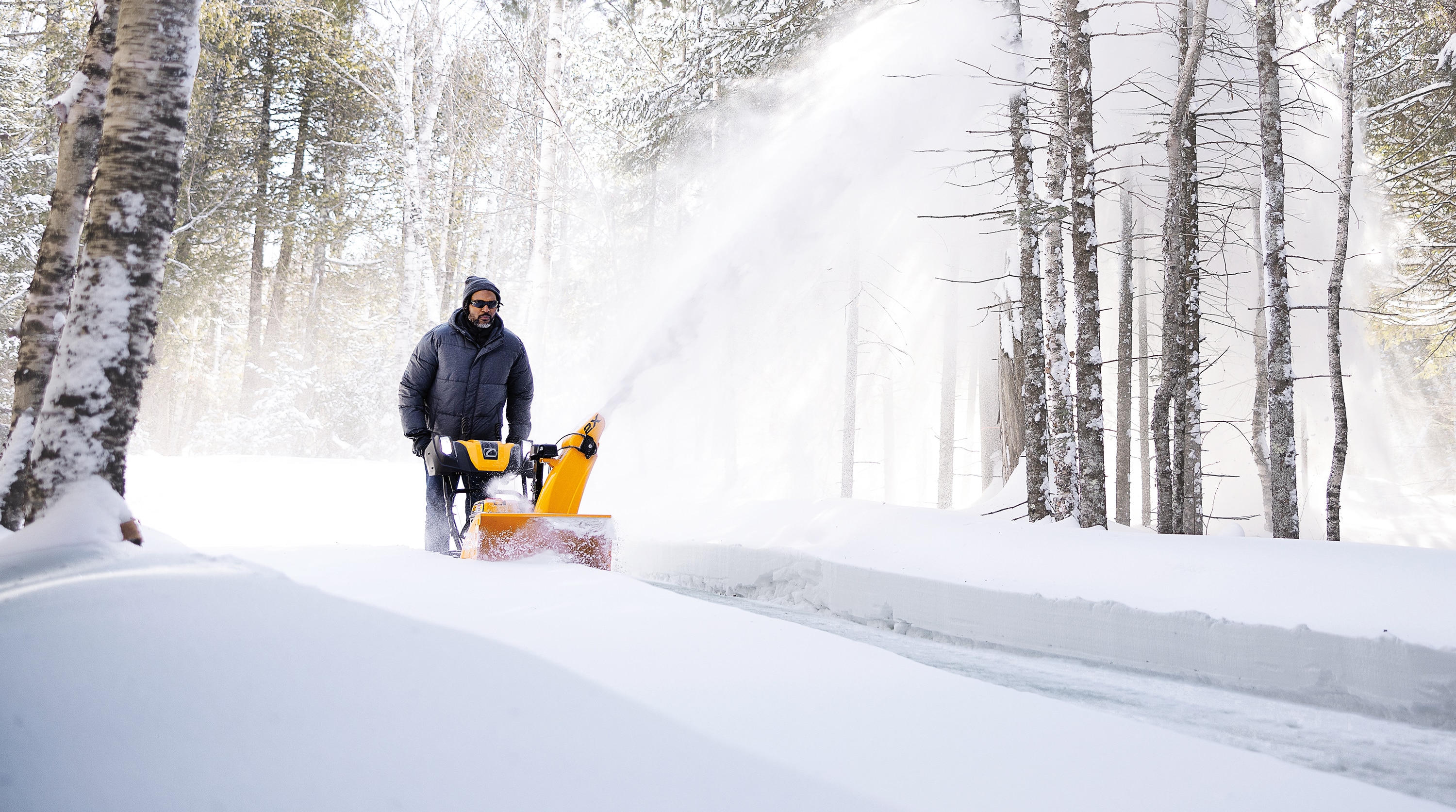 Cub Cadet 2X snow blower clearing a driveway