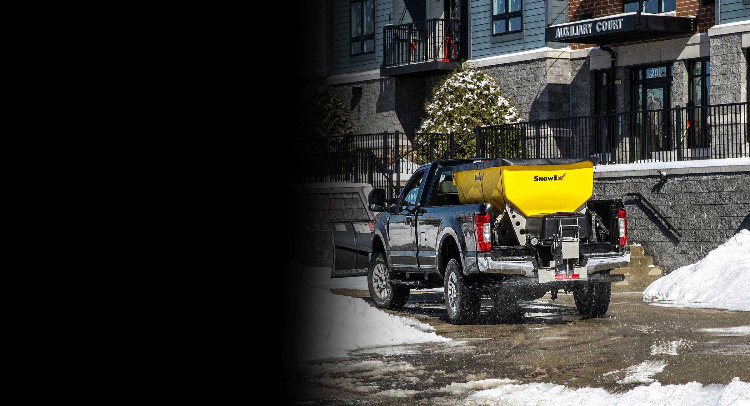 SnowEx HELIXX salt spreader on pickup truck