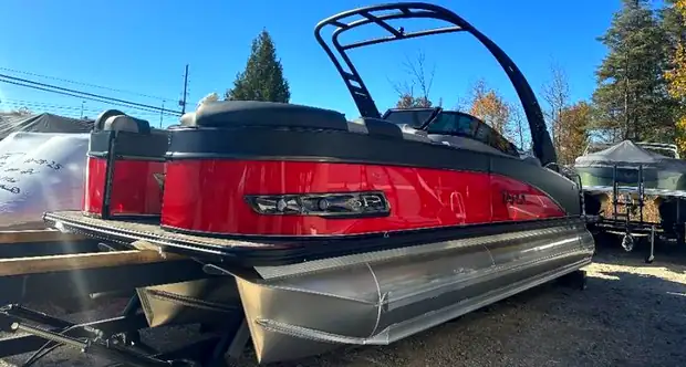 Red Tahoe tritoon on the lot at Outdoor Equipment Co.